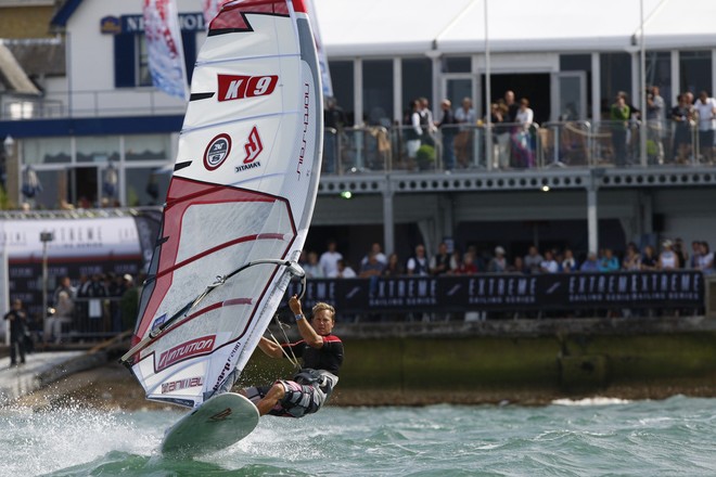 Professional windsurfer, Guy Cribb, showing off in front of the crowds at Act 2, in Cowes for the 2010 Extreme Sailing Series - Extreme Sailing Series 2011 © Paul Wyeth / www.pwpictures.com http://www.pwpictures.com